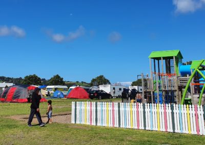 Whangateau Holiday Park powered sites and playground